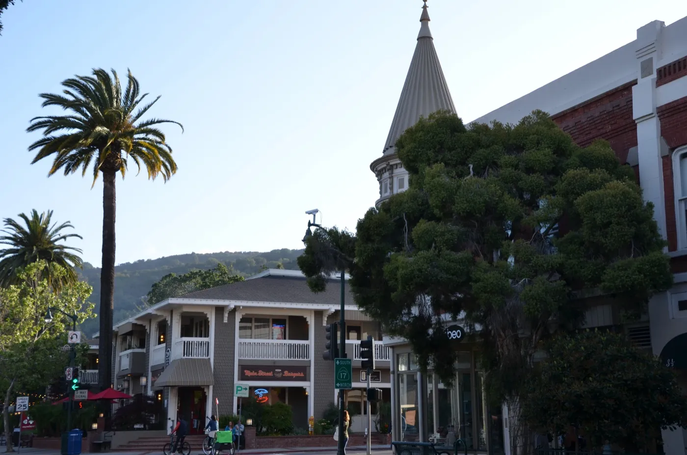 The intersection of Main Street and Santa Cruz Avenue in downtown Los Gatos, California, with storefronts and street trees