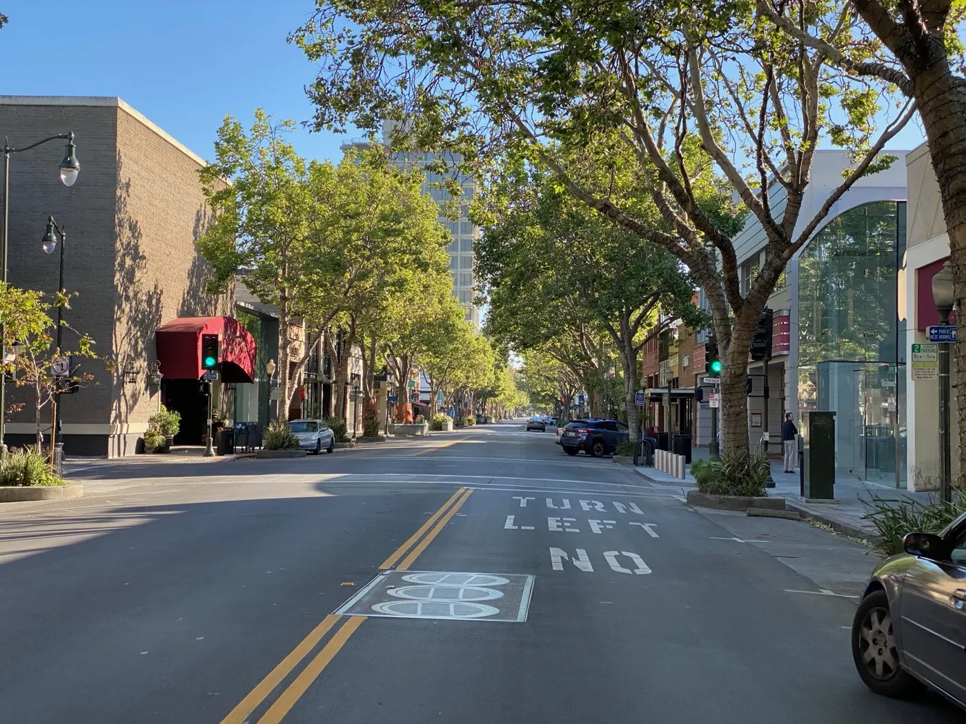 Downtown Palo Alto storefronts and street trees along University Avenue at Florence Street.