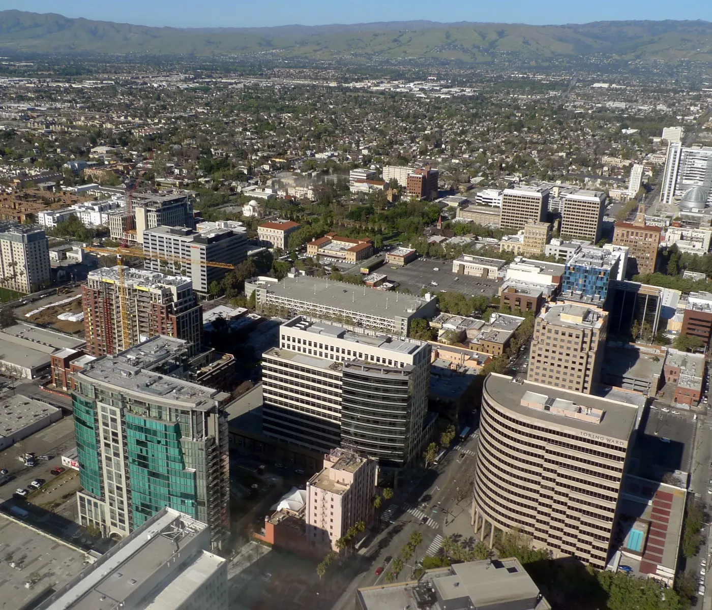 Aerial view of downtown San Jose, California, showing high-rise office towers and city streets