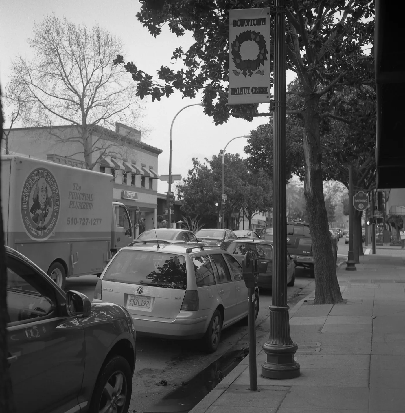 Downtown Walnut Creek, California, looking along Main Street with storefronts and street trees